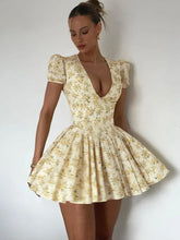 Women's Yellow Floral V-Neck Vacation Dress with Pleated Design