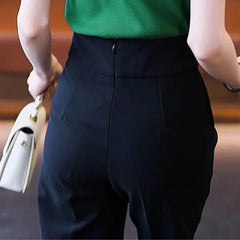 Pantalon de costume noir taille haute pour femme avec fermeture éclair et poches à l'arrière