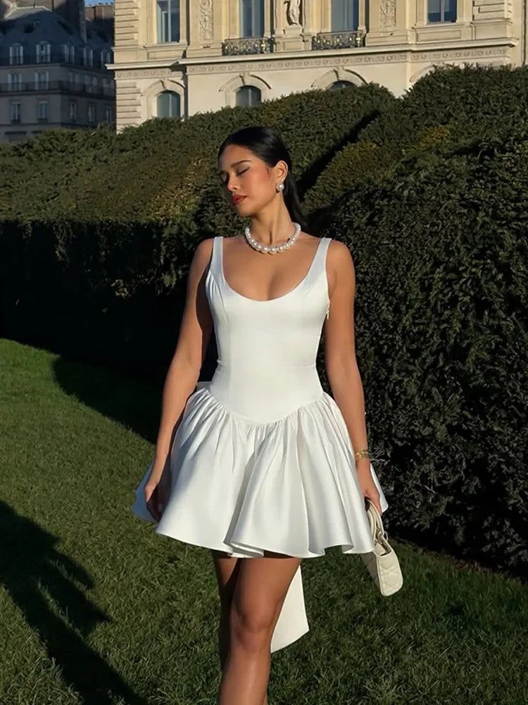 White Dress with Flared Skirt and Large Bow Detail