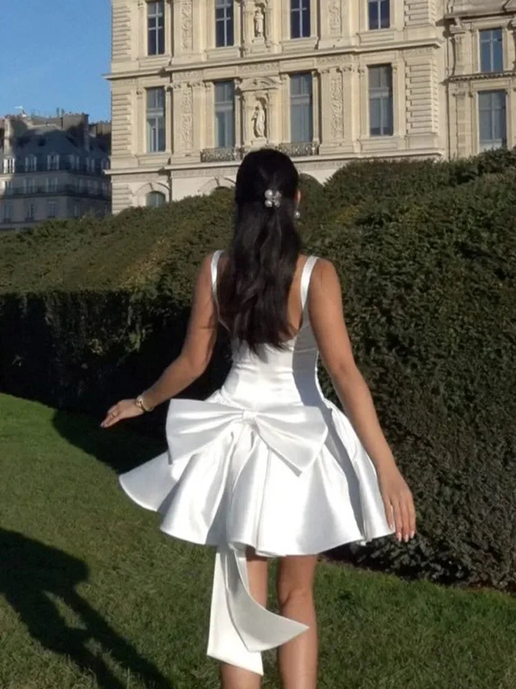 White Dress with Flared Skirt and Large Bow Detail