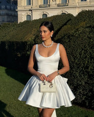 White Dress with Flared Skirt and Large Bow Detail